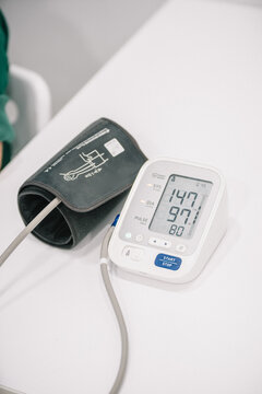 Blood pressure monitor showing high results on display