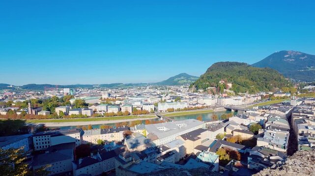 SALZBURG, AUSTRIA &ndash; OCTOBER 03, 2025: A high-angle panoramic view of the historic city center featuring the cathedral and fortress. The footage captures the urban landscape, river, and surrounding mou
