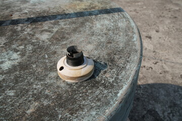 Old Light Bulb Socket on a Weathered Concrete Table