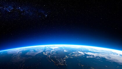   
View of Earth’s curved horizon from space as sunlight bursts over the edge, illuminating landmasses and city lights beneath a starry sky—capturing the planet’s beauty and cosmic scale.