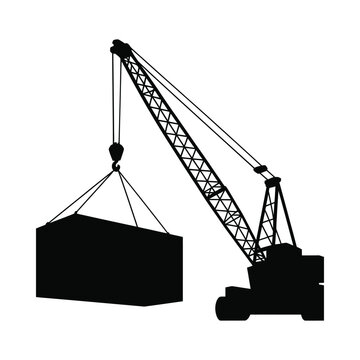 Silhouette of a construction crane lifting a large rectangular cargo box