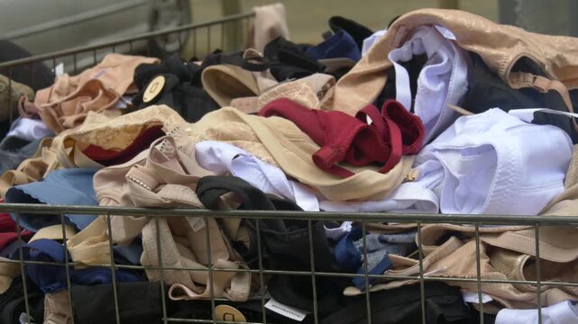 Different Types of Bras and Lingerie Textures Mixed Together in Basket