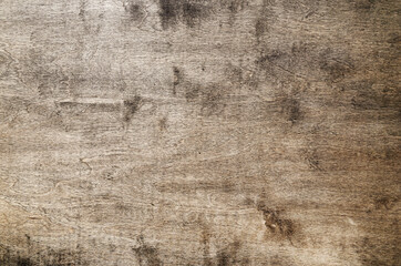 Weathered wooden texture with natural grain, scratches, stains, and uneven brown tones. Rustic wood background suitable for design projects, mockups, branding, posters, and creative layouts.