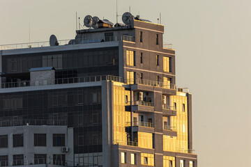 Modern office building facade in golden sunset light