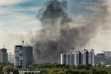 Thick black smoke over Kyiv residential buildings