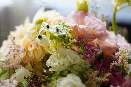 White roses and lisianthus in lush mixed bouquet close-up