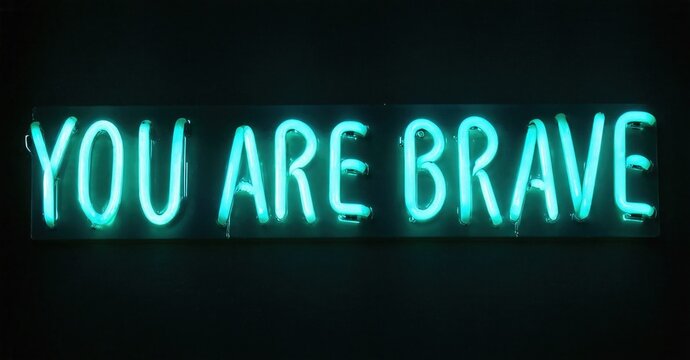 Bright neon sign displays positive message. Dark background emphasizes glowing text, creating inspirational visual. - Powered by Adobe