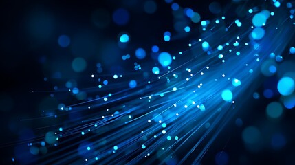 Abstract depiction of glowing blue light strands and bokeh against a dark background