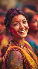 Smiling Indian woman with colorful powder during a festive celebration in a busy location
