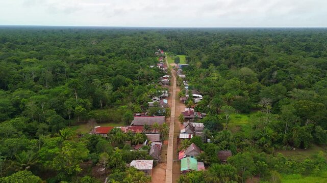 Aerial drone view of a village in the Amazon, not far from Iquitos, Peru. Traditional homes and everyday life surrounded by the rainforest.