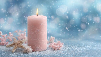 Pink candle with starfish and decorative elements against a snowy background