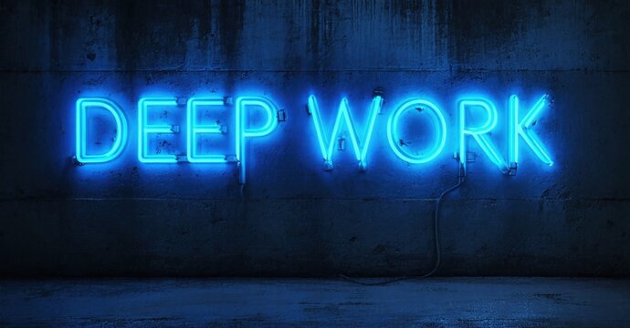 Bright neon sign displays DEEP WORK against textured dark wall. Minimalist aesthetic, cool blue tones dominate composition. Focus, productivity concept.