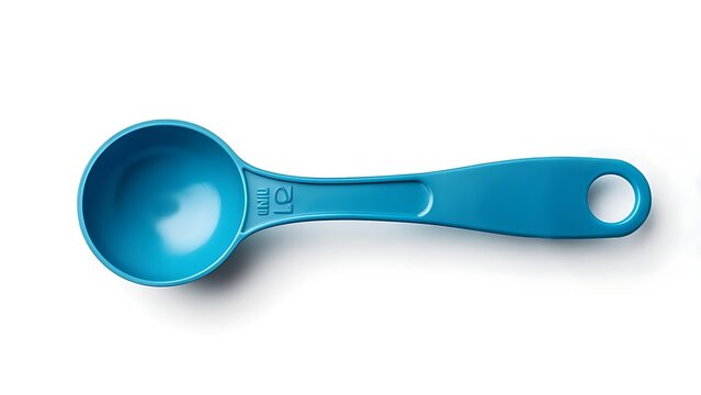 A top-down view of a turquoise measuring spoon on a white surface, revealing its scoop and handle with a hanging hole