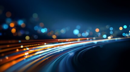 Dynamic visual of blurred light trails curving through a darkened space with bokeh effects