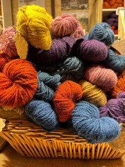 Colored knitting threads on the store shelf. Close-up.