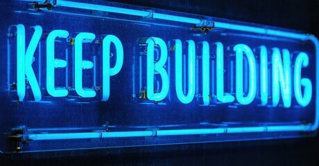 Obraz premium Bright neon sign displays positive message. Blue light glows against dark background. Simple rectangular frame surrounds text.