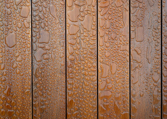 Water droplets on wooden planks background
