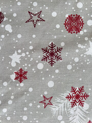 Christmas fabric with red snowflakes and white stars pattern