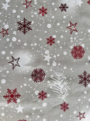 Christmas winter holiday fabric with red snowflakes pattern