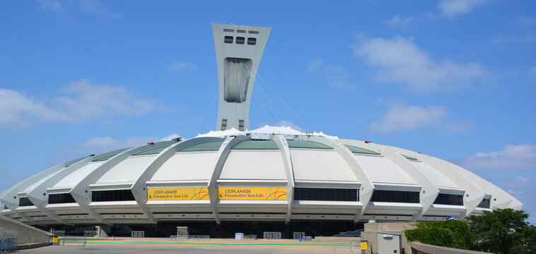 MONTREAL CANADA AUGUST 17 2015 : Montreal Olympic Stadium tower & olympic rings & cauldron. It's the tallest inclined tower in the world.Tour Olympique stands 175 meters tall and at a 45-degree angle