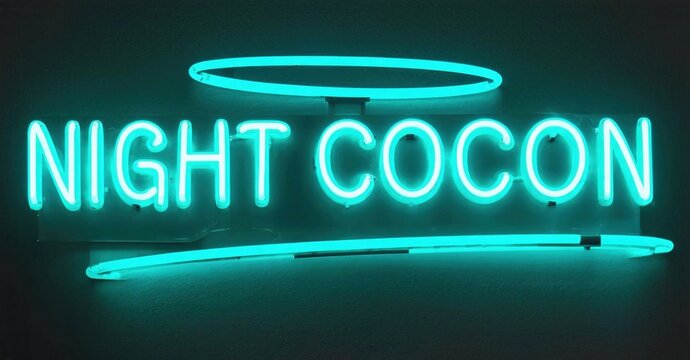 Bright turquoise neon sign displays NIGHT COCON text. Halo shape above words, horizontal line below. Dark background enhances glow.