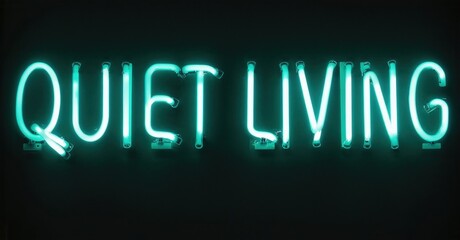 Bright turquoise neon sign displays words Quiet Living. Dark background emphasizes glowing text. Simple, modern aesthetic.