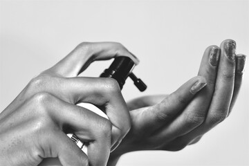 Close-up of person using hand sanitizer on palms, showing hygiene, cleanliness, health protection and infection prevention concept