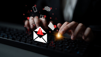 Image of hands on a keyboard with digital alerts and warnings symbolizing cybersecurity threats and the importance of online safety in the digital age. Gantry