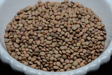 Obraz premium The Castelluccio di Norcia Lentils are a prized, small, striped legume, grown on the Castelluccio plateau, famous for its thin, tender skin.
