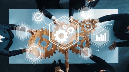 Collaborative Business Team Working Together with Gears and Digital Icons for Innovative Solutions and Strategic Planning in Modern Office Environment Gluon.