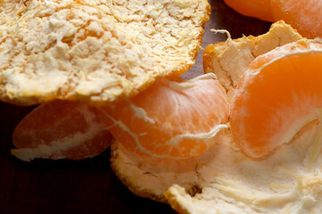 Sweet citrus segments laid bare on a rustic wooden table