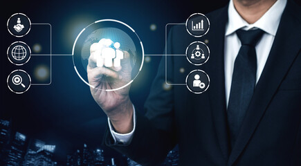 Business teamwork connected around a globe representing cooperation, leadership, and organizational...