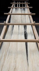 somen. Thin white Japanese somen noodles arranged neatly on a traditional bamboo drying rack, highlighting texture and orderly lines. lifestyle magazines.
