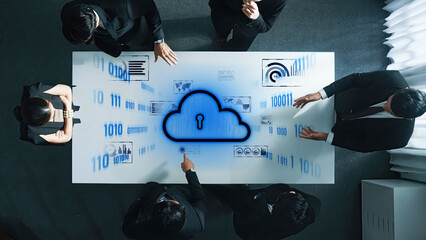 Professionals engage in strategic discussions about cybersecurity and data protection, utilizing cloud technology and digital data in a modern office environment. Trope