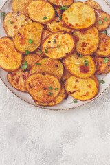 Crispy potato slices, with parmesan cheese and spices, fried in the oven, homemade, no people,