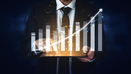 A businessman in a suit displays a digital tablet with elegant visualizations of financial growth and analytics. The dark background enhances the professionalism and focus on data. Impute