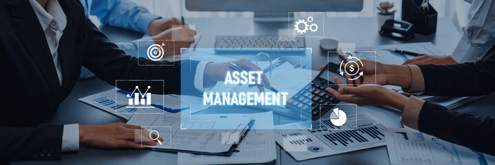 Business professionals engage in asset management discussions, analyzing financial documents and data during a meeting in a modern office environment. Trope
