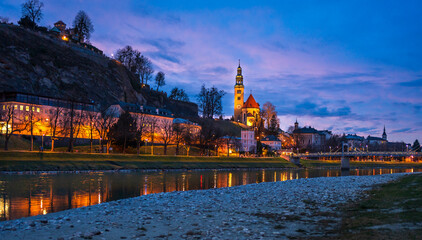 Evening view of Salzac River, Salzburg Old town, church in Austria.