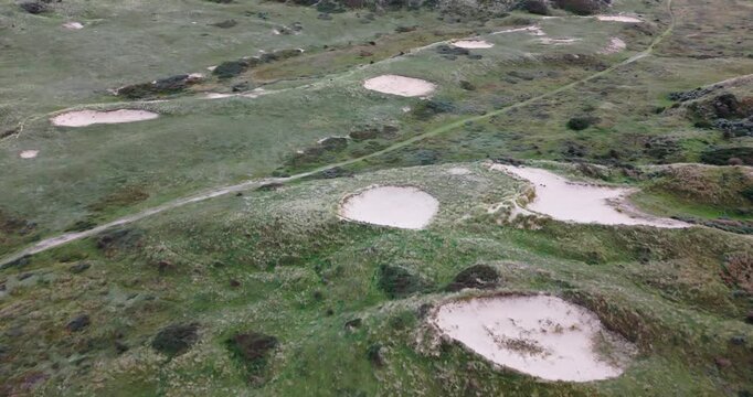 drone flying over green dune areal at egmond aan zee