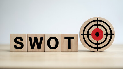SWOT analysis wooden blocks with target symbol for business strategy.