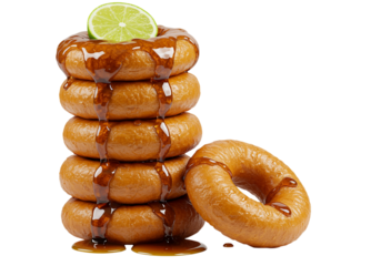 Stack of caramel doughnuts with lime isolated on transparent background