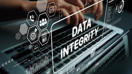 Focused Hands Typing on a Laptop with Data Integrity Interface Graphics Overlaying the Screen. Asymptotic smart data analytic.