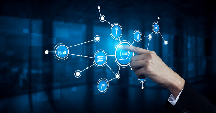 A hand interacts with a digital interface in a modern office, showcasing technology and data visualization that represents business innovation and strategy. Tessel - Powered by Adobe