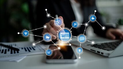 A modern digital marketing scene featuring a smartphone, business charts, and ads visualization in an office setting, showcasing technology and connectivity. Tessel