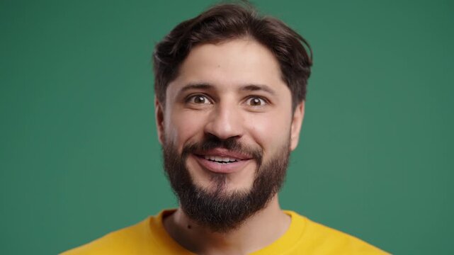 Handsome Amazed Man Reacts With Wow Expression, Open Mouth On Green. Discovery, surprise, success, great news, impressive results