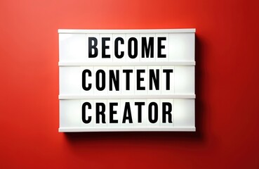 Lightbox with text Become Content Creator stands on red background. Concept for online creators education and career start. Idea for digital media.