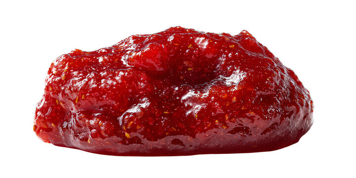 Closeup of glistening strawberry jam with visible fruit pieces, isolated on a black background
