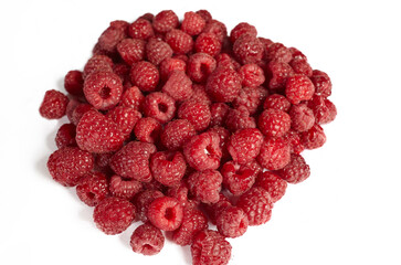 Fresh raspberries isolated on white background. Heap of red rasberries