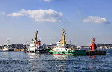 Naklejka premium The tug boat fleet on service at Moji port in Kitakyushu, Japan.
