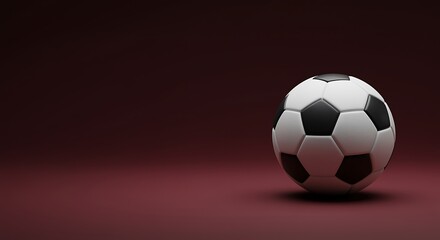 Naklejka premium A soccer ball on a maroon colored surface and background